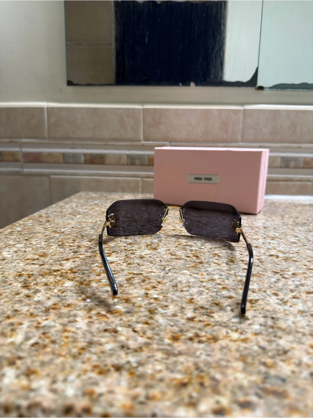 Miu Miu Rimless Sunglasses with Black Lenses and Gold Temples